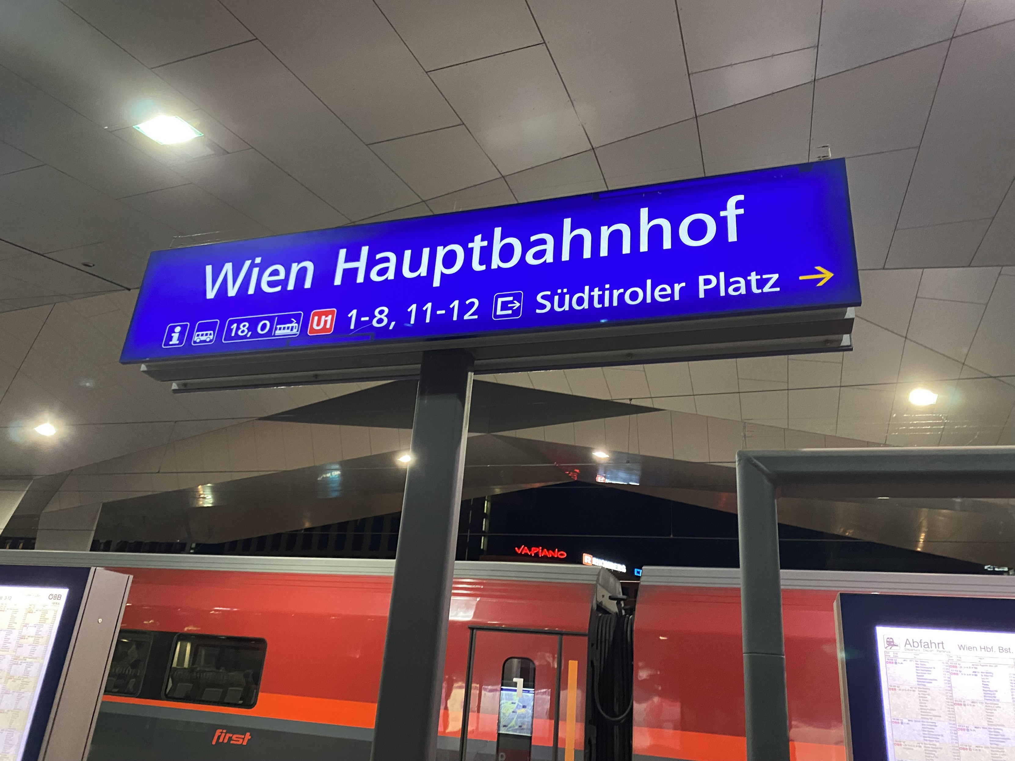 Train station sign reads “Wien Hauptbahnhof”